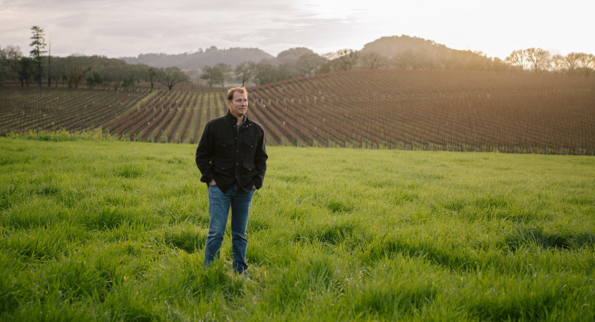 Winemaker, Graham Weerts standing in the Field Stone vineyard.